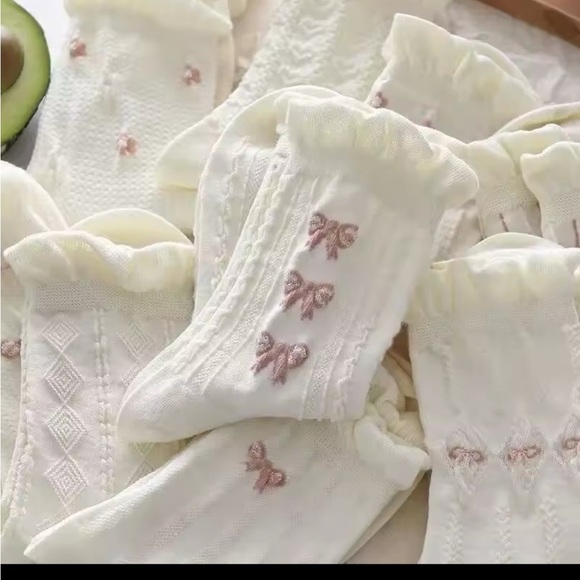 Elegant Cream Socks with Bow Accents
0219 - Picture 3 of 5